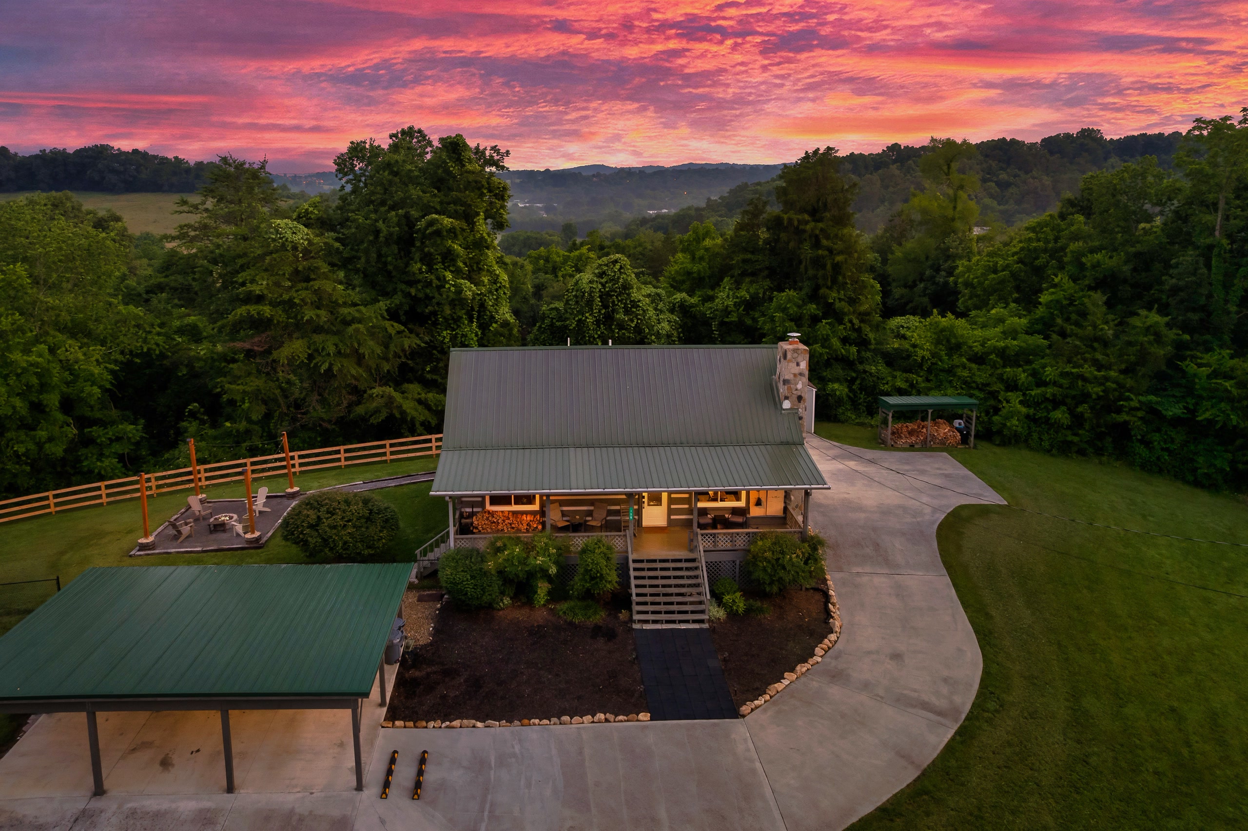 Hillside Haven cabin rear view with landscaped grounds at sunset in Tennessee