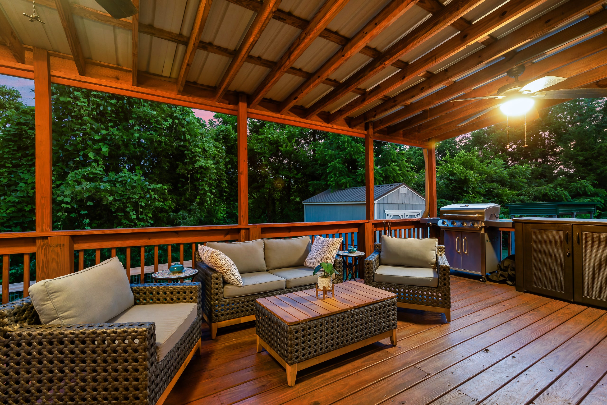 Hillside Haven covered deck with outdoor furniture and grill in Tennessee