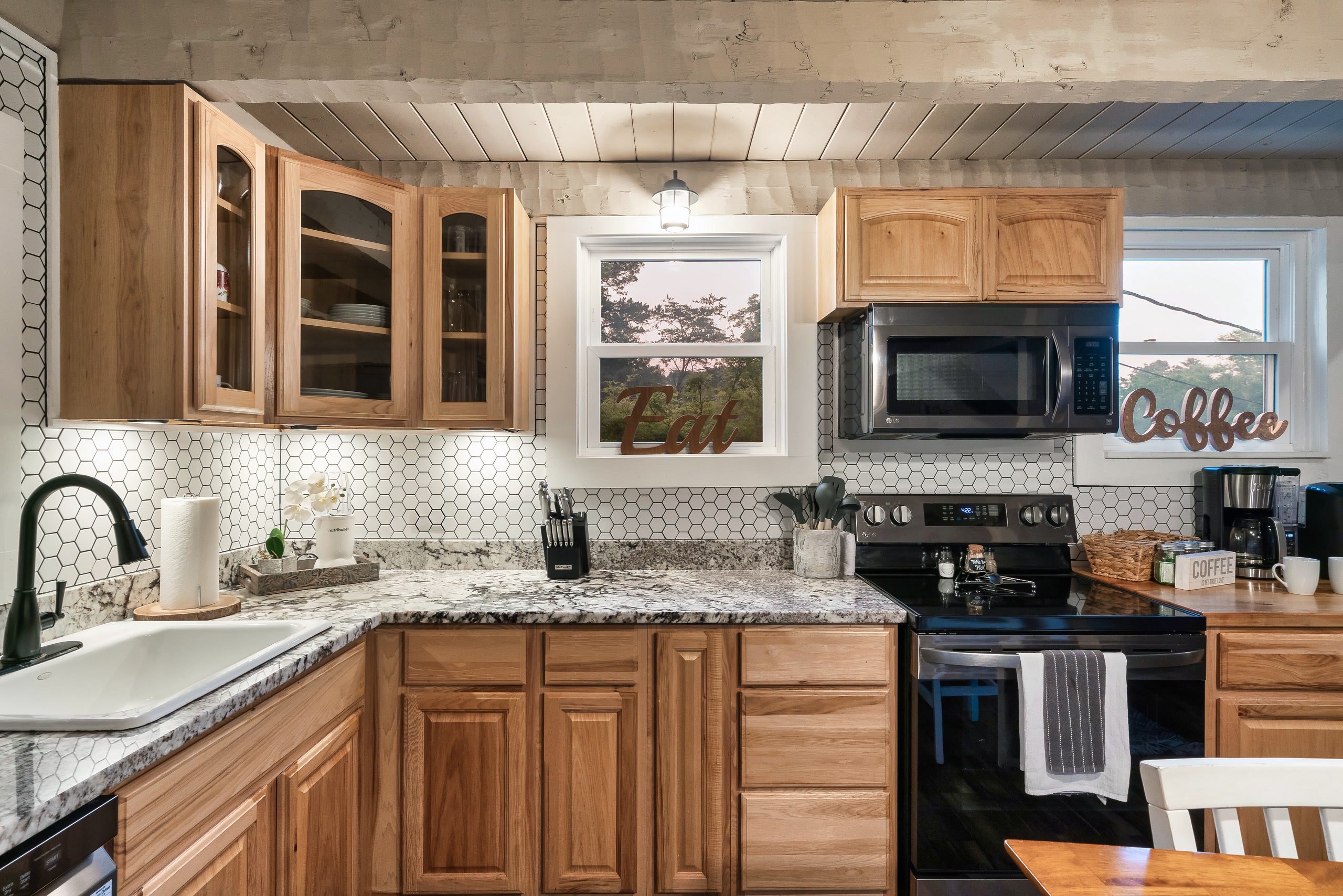 Hillside Haven kitchen with stainless appliances and wood cabinets in Tennessee