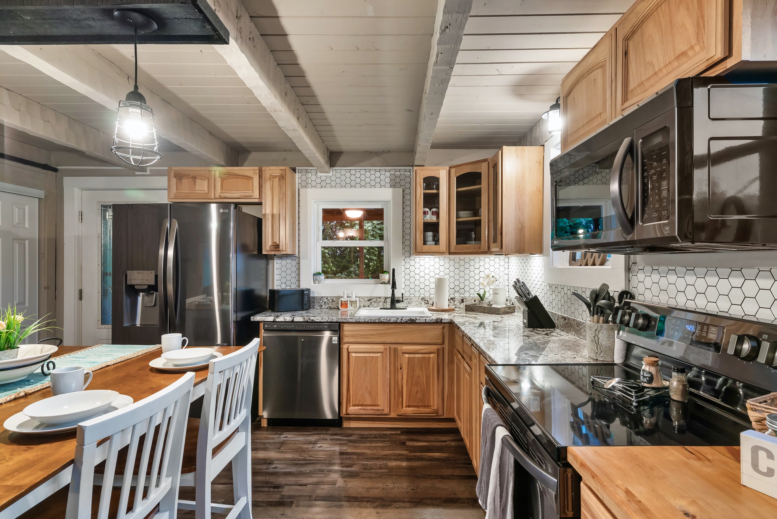 Hillside Haven U-shaped kitchen with dining area in Tennessee cabin