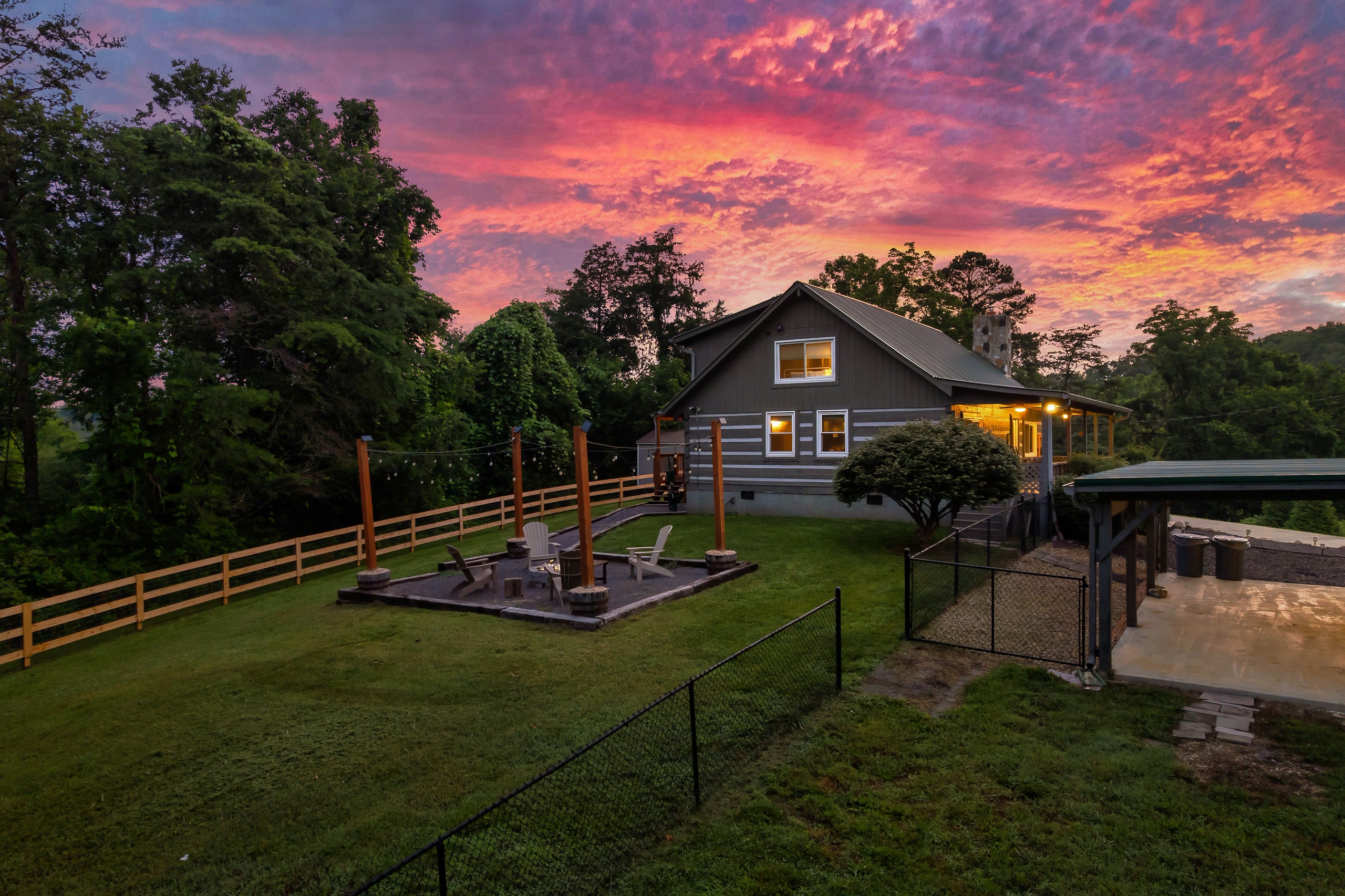 Hillside Haven cabin with fenced fire pit area and dog run at sunset in Tennessee