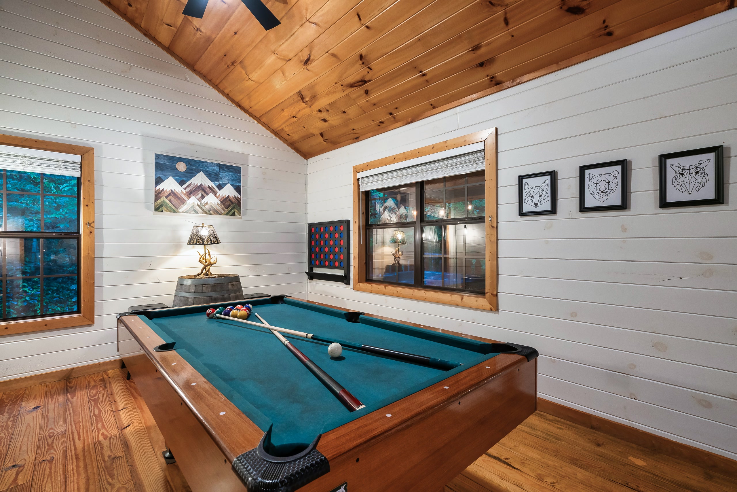 Pool table with geometric animal art in Smoky Creek Hideaway game room