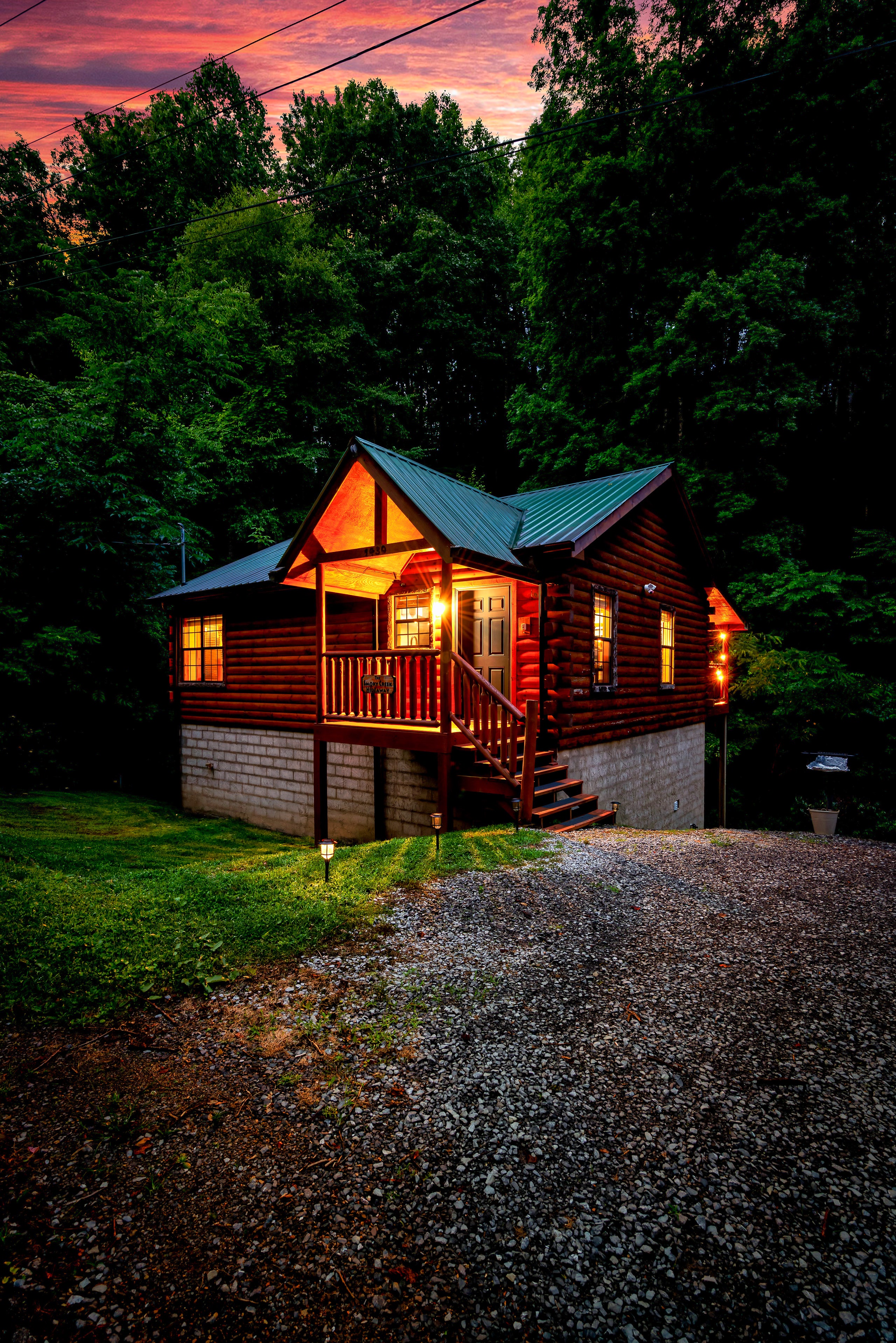 Smoky Creek Hideaway illuminated at sunset in Tennessee Smoky Mountains