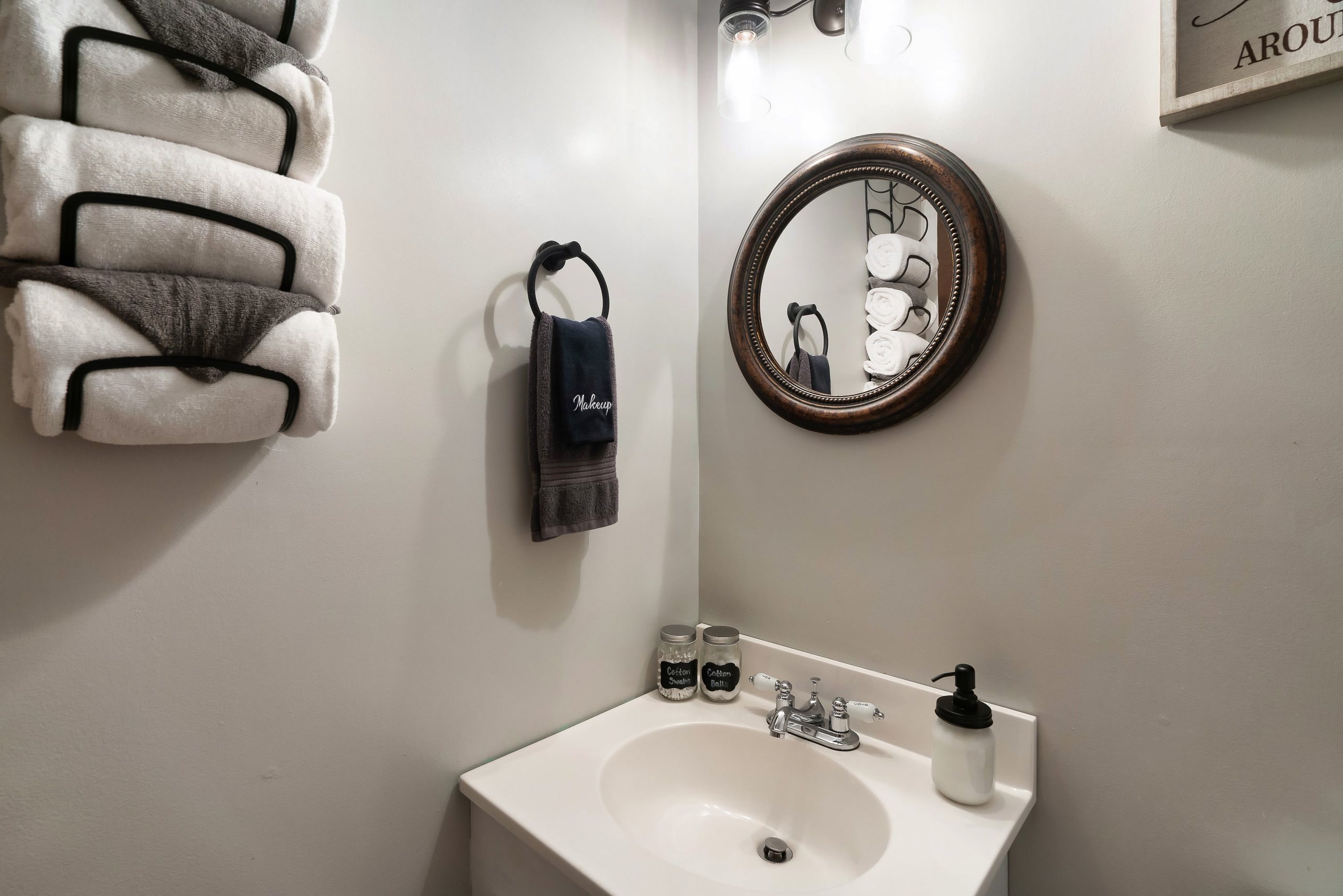 Compact bathroom with pedestal sink at Rustic Rooster cabin