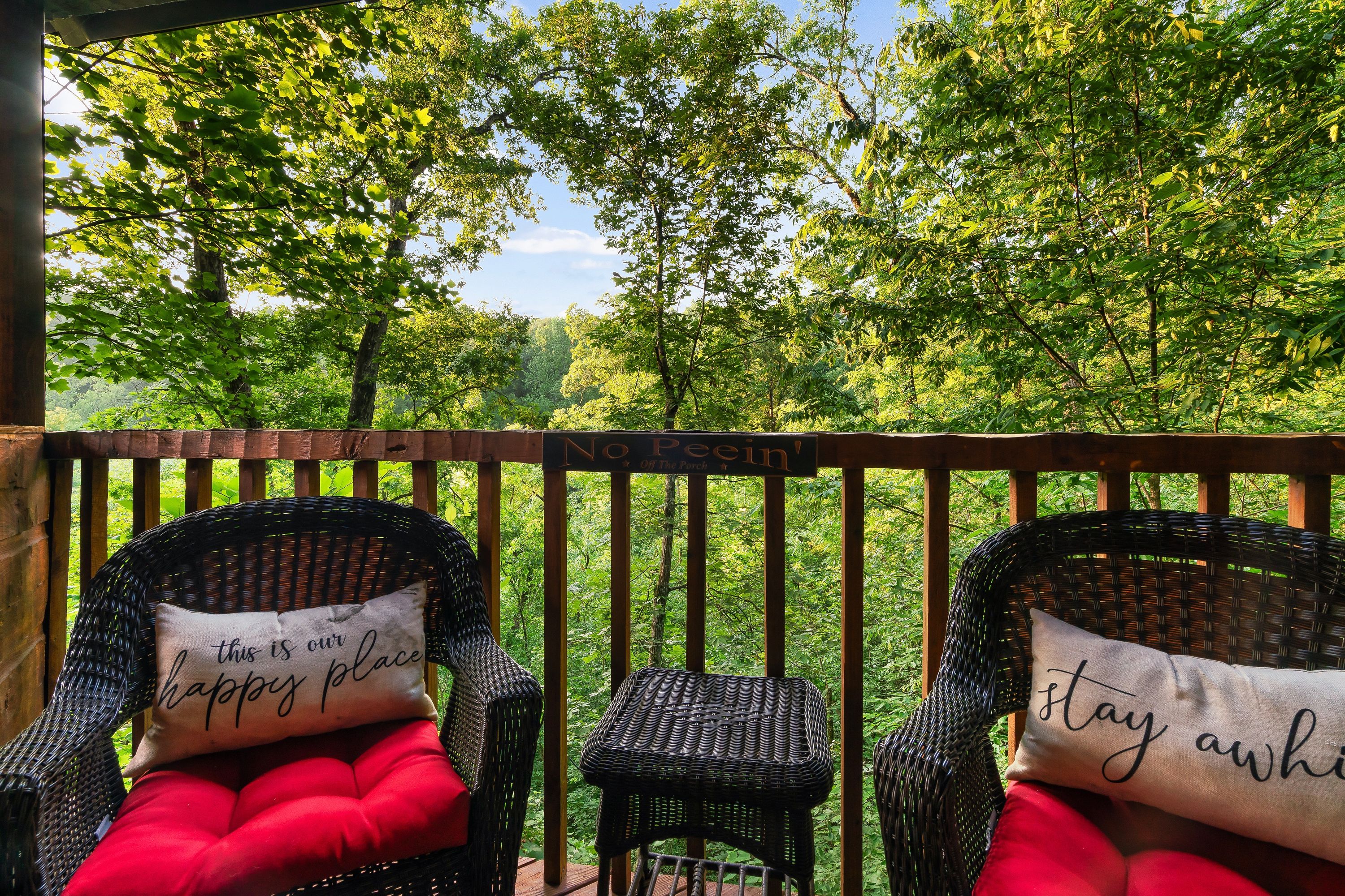 Deck seating with forest canopy views at Rustic Rooster Tennessee
