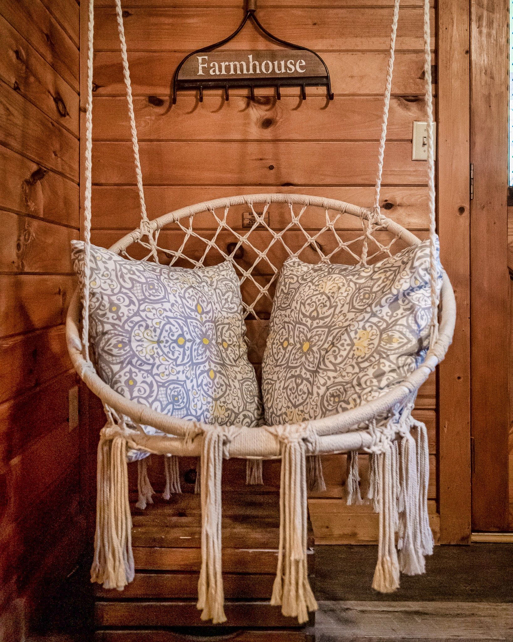 Macrame hanging chair in bedroom at Rustic Rooster Tennessee cabin